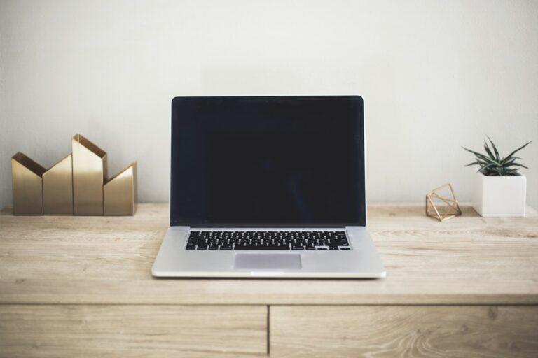 Laptop on a desk ready to build a website